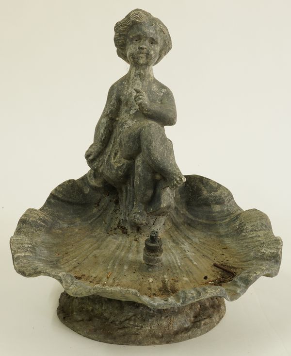 A LEAD FOUNTAIN MODELLED AS A CHERUB IN AN OPEN SHELL