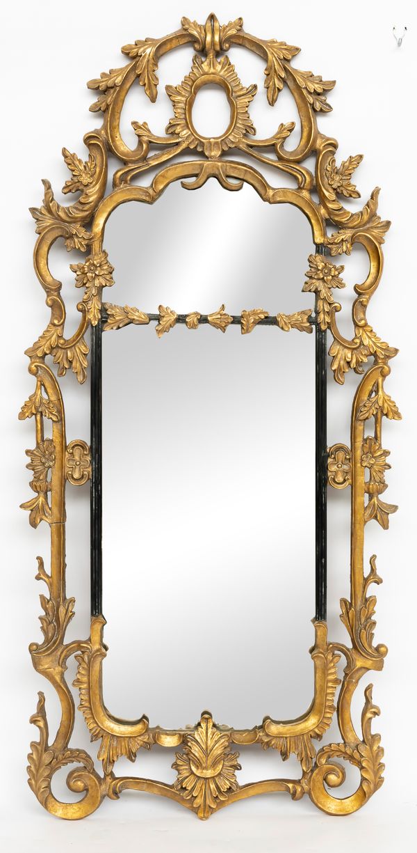 A GEORGE III STYLE GILT FRAMED MIRROR WITH PIERCED FOLIATE BORDER