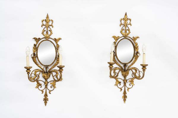 A PAIR OF OVAL GOLD PAINTED METAL TWIN LIGHT GIRANDOLE MIRRORS (2)