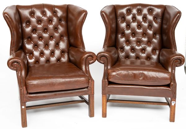 A PAIR OF 18TH CENTURY STYLE BROWN LEATHER UPHOLSTERED WING BACK ARMCHAIRS (2)