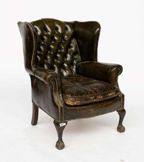 A MID-18TH CENTURY STYLE STUDDED GREEN LEATHER UPHOLSTERED WINGBACK ARMCHAIR