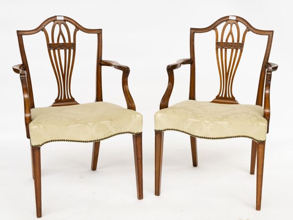 A PAIR OF GEORGE III MAHOGANY SHIELD BACK OPEN ARMCHAIRS (2)