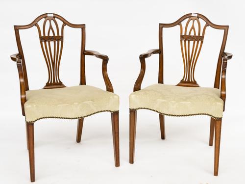 A PAIR OF GEORGE III MAHOGANY SHIELD BACK OPEN ARMCHAIRS (2)