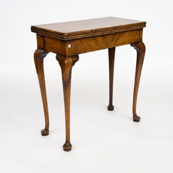 RETAILED BY GILL & REIGATE, LONDON; AN EARLY 20TH CENTURY QUEEN ANNE STYLE WALNUT CONCERTINA ACTION CARD TABLE