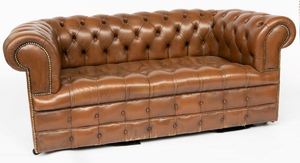 A BROWN LEATHER BUTTON-DOWN CHESTERFIELD SOFA