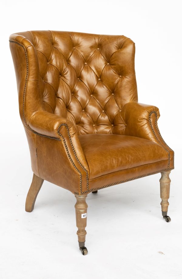 A MID-18TH CENTURY STYLE TAN LEATHER UPHOLSTERED TUB BACK ARMCHAIR