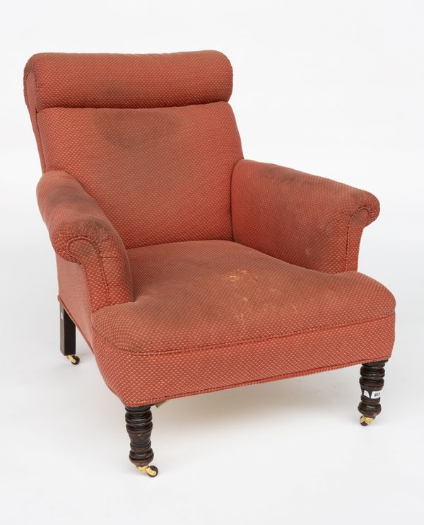 A LATE VICTORIAN EASY ARMCHAIR IN THE MANNER OF WILLIAM BIRCH