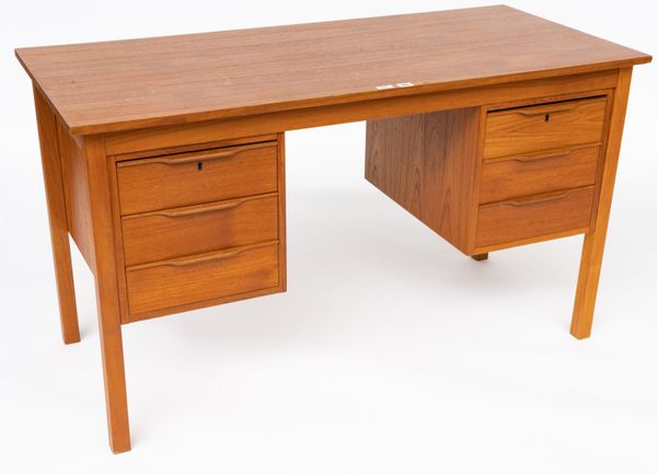 A MID-20TH CENTURY TEAK SIX DRAWER DESK