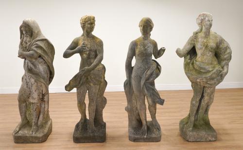 A SET OF FOUR 18TH CENTURY NORTH EUROPEAN CARVED MARBLE FIGURES EMBLEMATIC OF THE FOUR SEASONS (4)