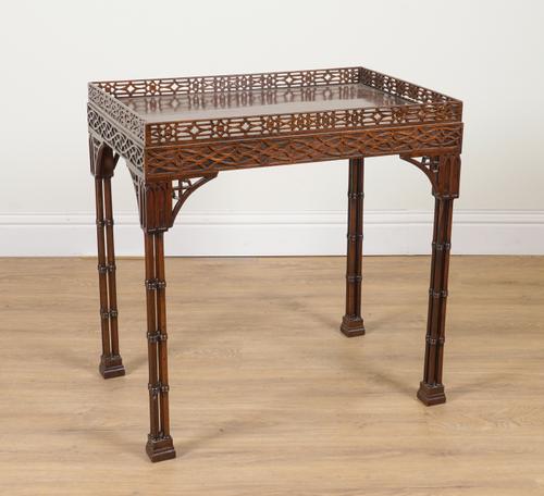 AN 18TH CENTURY STYLE MAHOGANY BLIND AND OPEN FRET CARVED RECTANGULAR SILVER TABLE