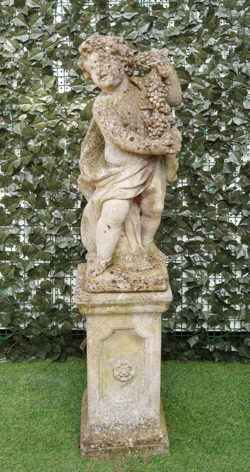 A RECONSTITUTED STONE FIGURE OF A YOUNG BACCHUS (2)
