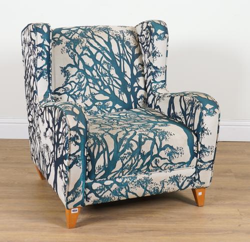 A MODERN WINGBACK EASY ARMCHAIR