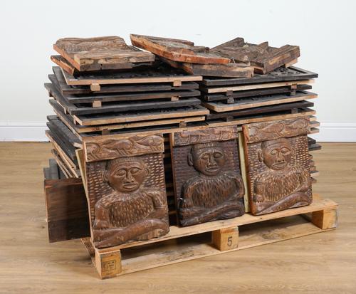 A SET OF THIRTY-TWO CARVED WALL PANELS OF AFRICAN DESIGN (32)