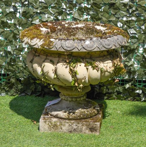 A LARGE RECONSTITUTED STONE GARDEN URN