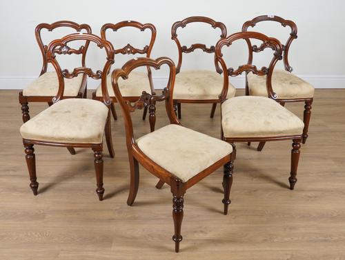A SET OF FOUR EARLY VICTORIAN ROSEWOOD CLOUD BACK DINING CHAIRS (7)