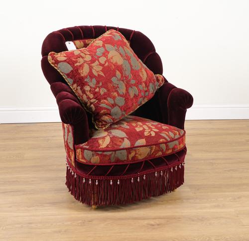 PROVASI: A BURGUNDY VELVET UPHOLSTERED SHELL BACK EASY ARMCHAIR