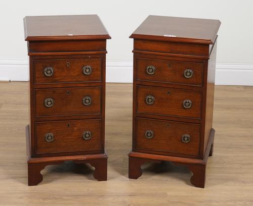 A PAIR OF MAHOGANY THREE DRAWER BEDSIDE TABLES (2)