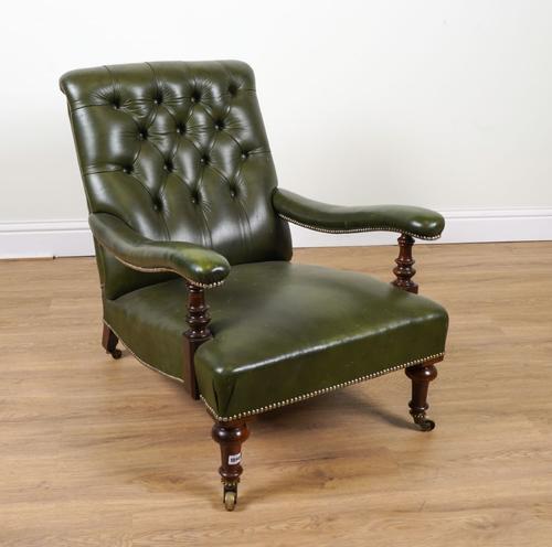 A VICTORIAN GREEN LEATHER UPHOLSTERED WALNUT FRAMED OPEN ARMCHAIR