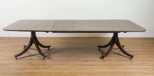 A GEORGE III STYLE MAHOGANY TWIN PILLAR D-END EXTENDING DINING TABLE