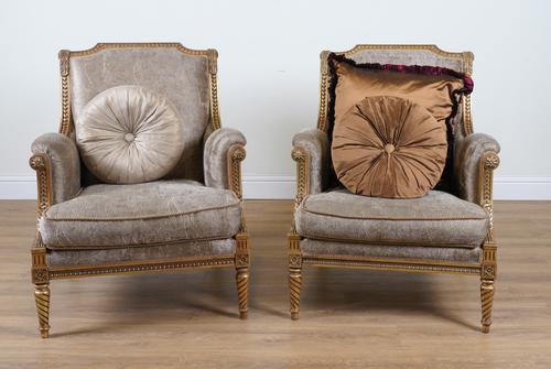 PROVASI: A PAIR OF FRENCH TRANSITIONAL STYLE GILT FRAMED ARMCHAIRS (2)