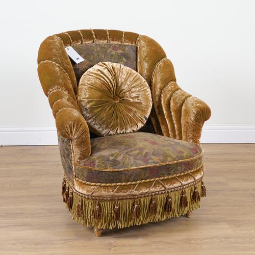 PROVASI: A GOLD VELVET UPHOLSTERED SHELL BACK EASY ARMCHAIR