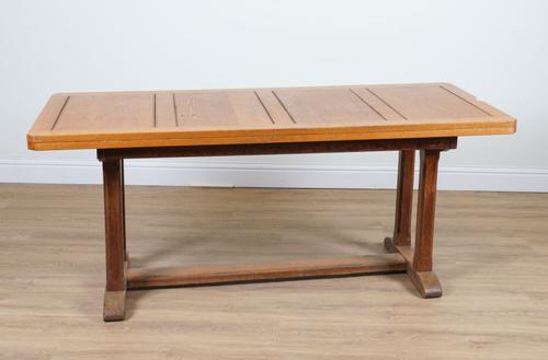 AN ARTS AND CRAFTS OAK CANTED RECTANGULAR DINING TABLE