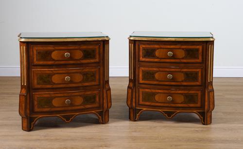 PROVASI: A PAIR OF KINGWOOD AND WALNUT PARCEL GILT BOWFRONT THREE DRAWER BEDSIDE TABLES  (2)