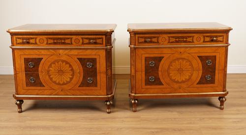PROVASI: A PAIR OF MARQUETRY INLAID WALNUT AND TULIPWOOD PARCEL GILT THREE DRAWER COMMODES (2)