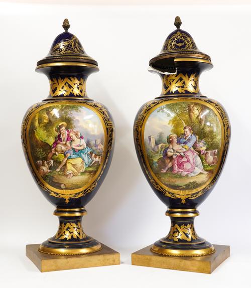 A LARGE PAIR OF SEVRES-STYLE EARTHENWARE VASES AND ASSOCIATED PORCELAIN COVERS