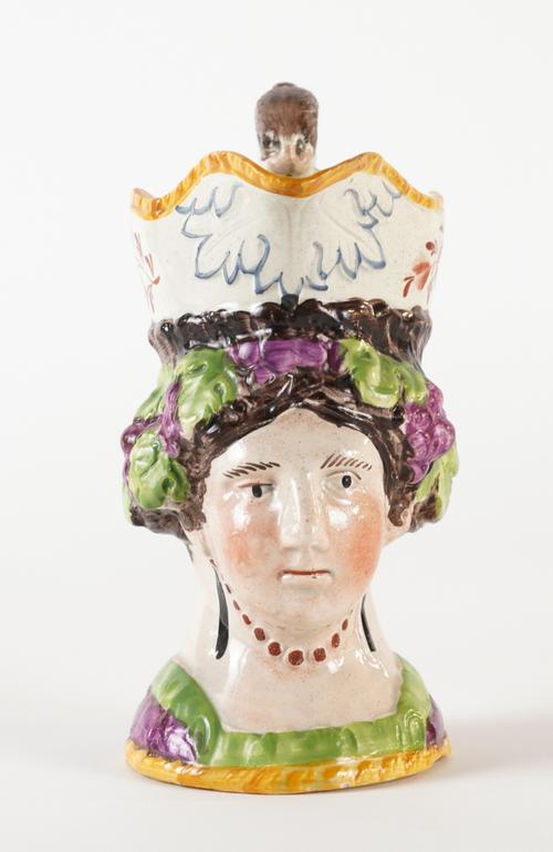A STAFFORDSHIRE POTTERY FEMALE MASK JUG
