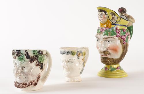 THREE PEARLWARE MASK JUGS (3)