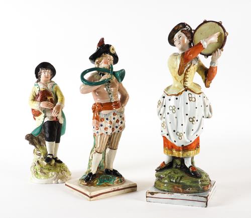 THREE STAFFORDSHIRE PEARLWARE FIGURES OF MUSICIANS (3)
