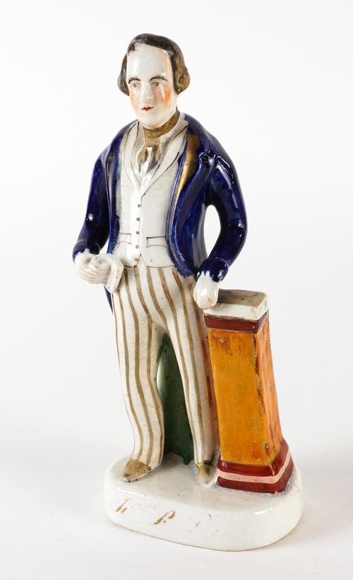 A STAFFORDSHIRE POTTERY FIGURE OF SIR ROBERT PEEL
