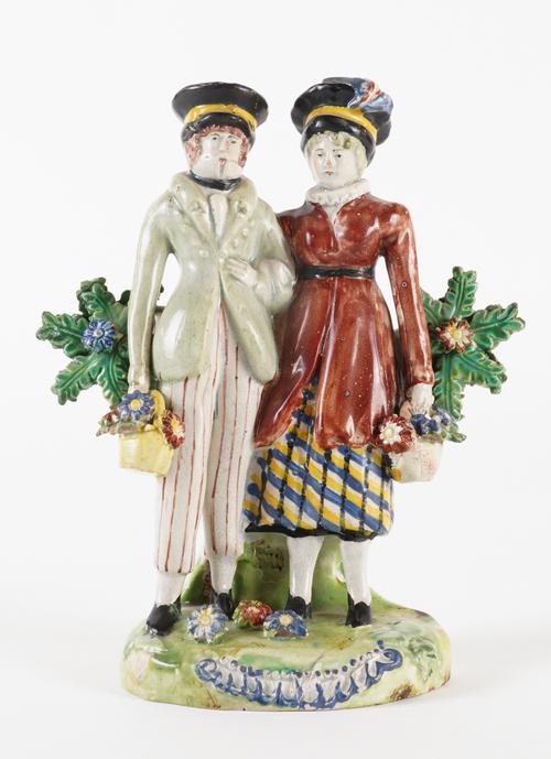 A STAFFORDSHIRE PEARLWARE GROUP OF THE DANDIES