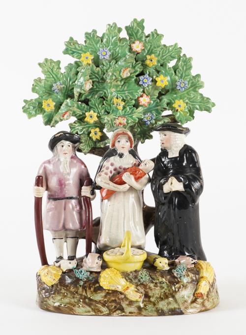 A STAFFORDSHIRE PEARLWARE TYTHE PIG GROUP