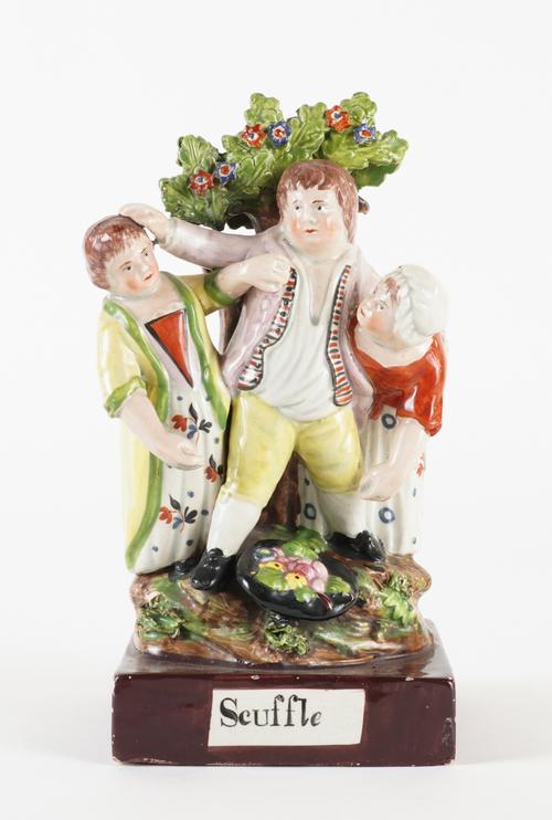 A STAFFORDSHIRE PEARLWARE GROUP OF THE SCUFFLE