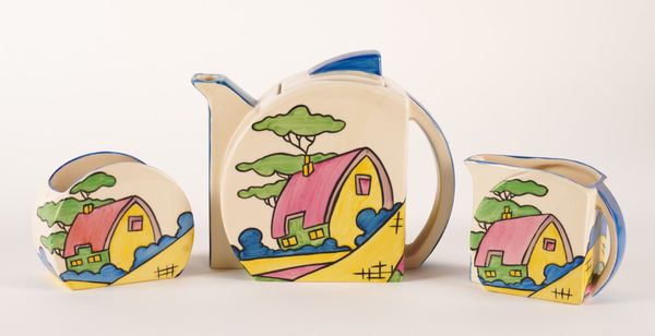 A WEDGWOOD `PINK ROOF COTTAGE TEA SET AFTER THE ORIGINAL BY CLARICE CLIFF