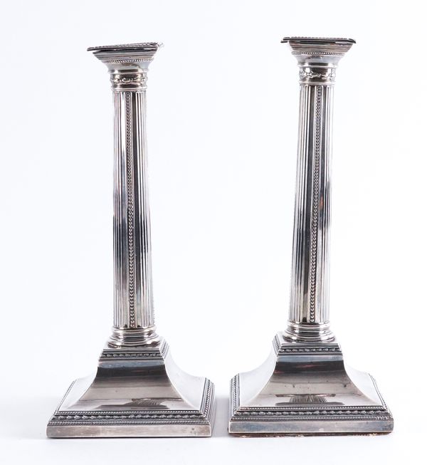 A PAIR OF EARLY GEORGE III SILVER TABLE CANDLESTICKS