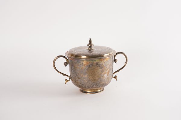 A SILVER TWIN HANDLED CUP AND COVER