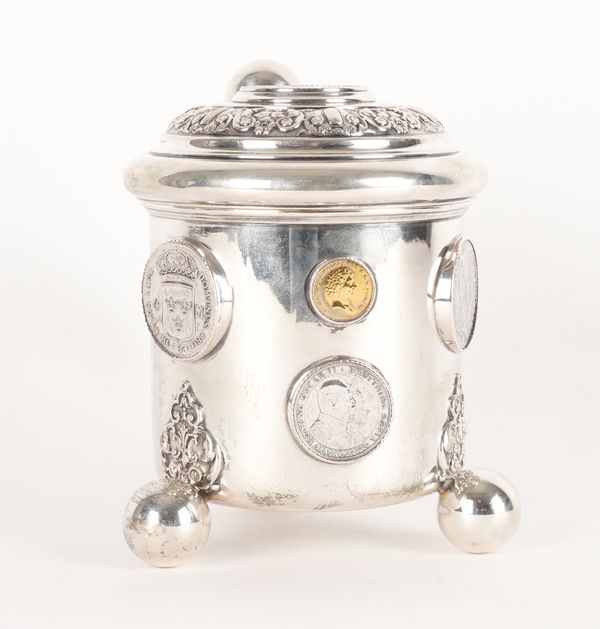 A SWEDISH TANKARD MOUNTED WITH COINS