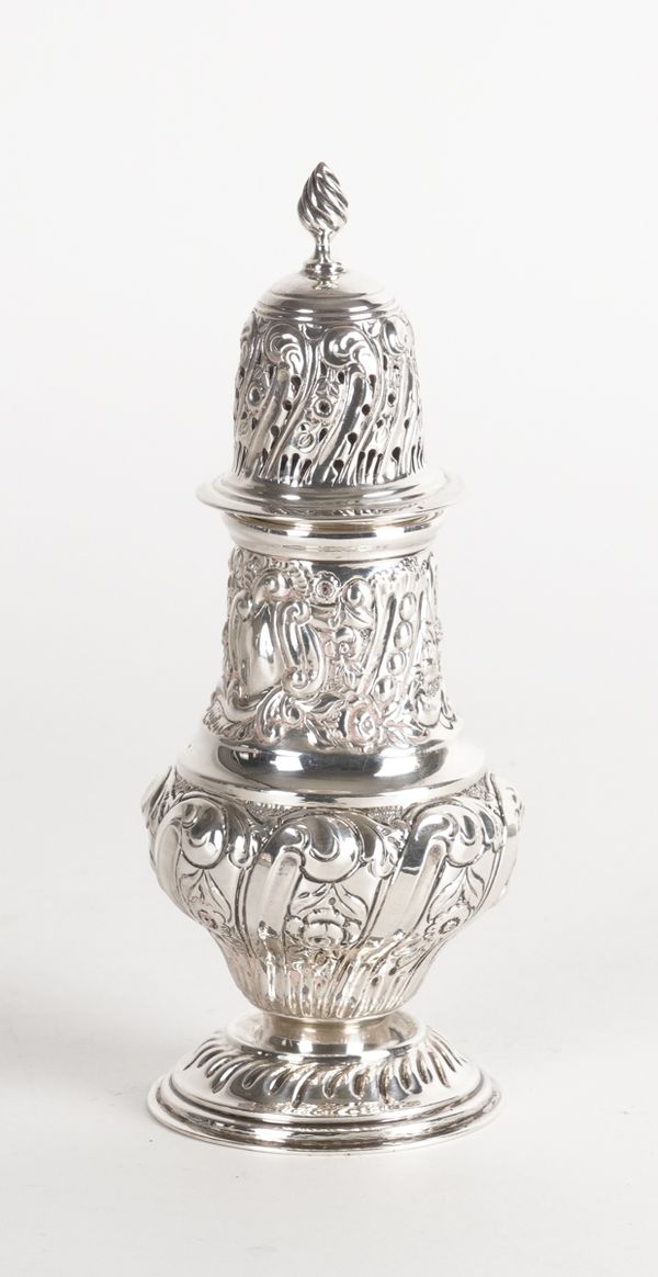 A SILVER SUGAR CASTER WITH EMBOSSED DECORATION