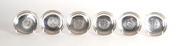 SIX MIDDLE EASTERN DISHES EACH MOUNTED WITH A COIN (6)