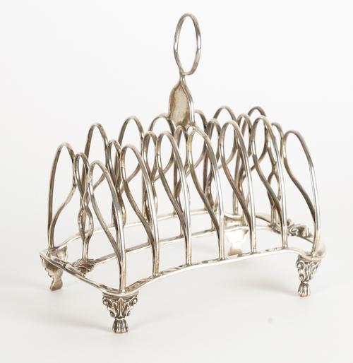 A GEORGE III SILVER SEVEN BAR TOASTRACK