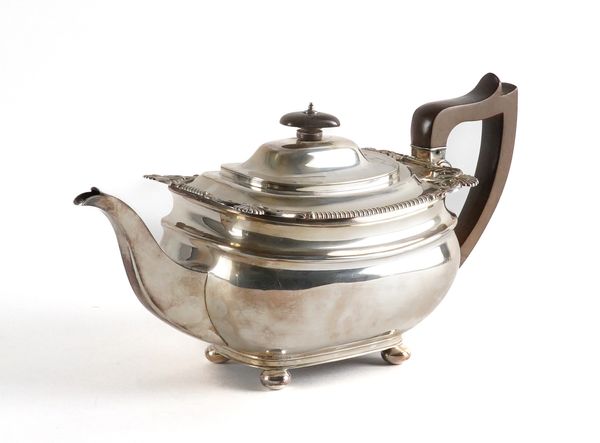 A SILVER TEAPOT