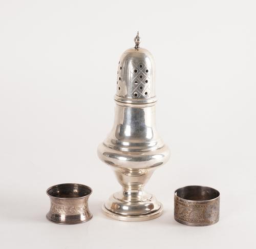 A SILVER SUGAR CASTER AND TWO SILVER NAPKIN RINGS (3)