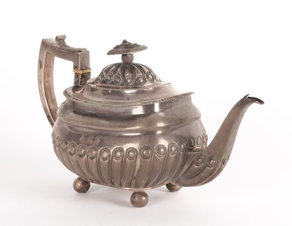 A GEORGE III SILVER TEAPOT