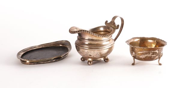 A SILVER MILK JUG, A SILVER MOUNTED OVAL TEAPOT STAND AND A SMALL SILVER BOWL (3)