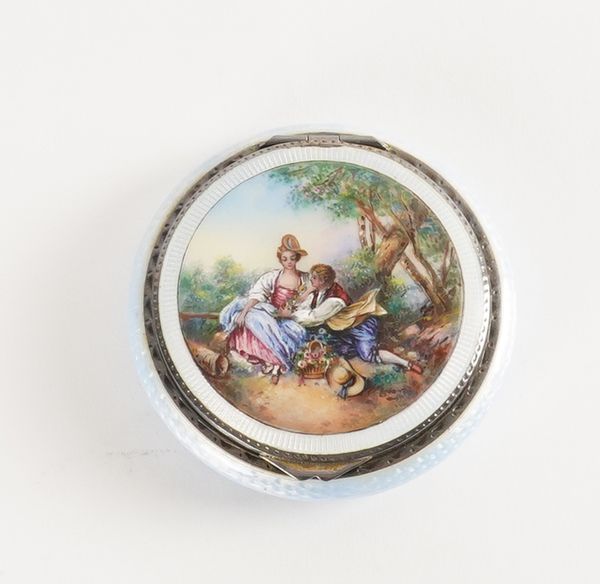 A LADY'S SILVER AND ENAMELLED POWDER COMPACT