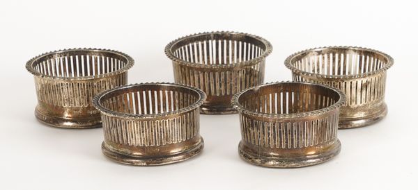 A SET OF FIVE SILVER MOUNTED OAK COASTERS (5)