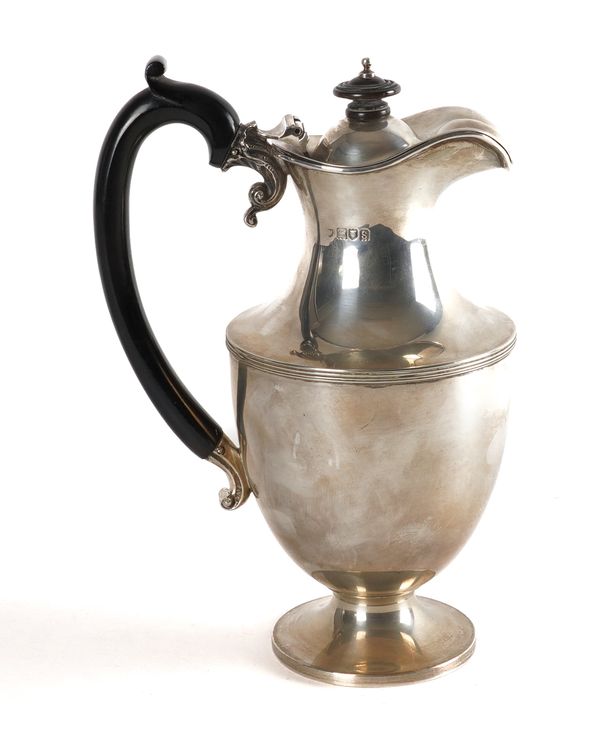 A SILVER HOT WATER JUG